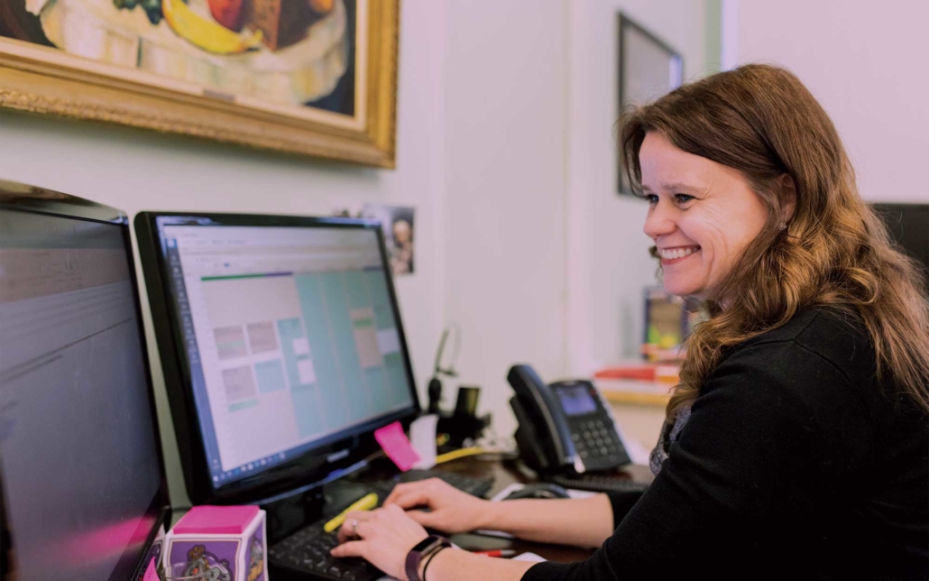 happy woman on a computer working