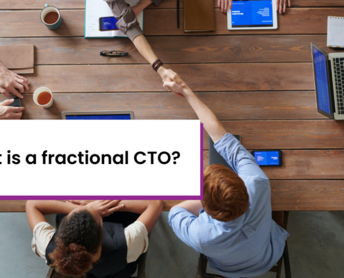 Title card: "What is a fractional CTO?" Background is six people around table with two shaking hands across the table.