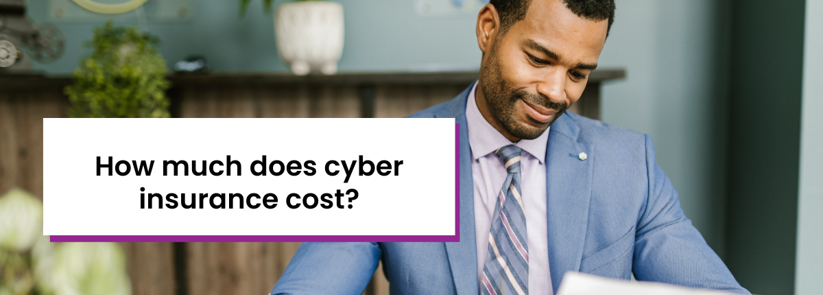 How much does cyber insurance cost? Background: Black man in blue suit holding document and pen