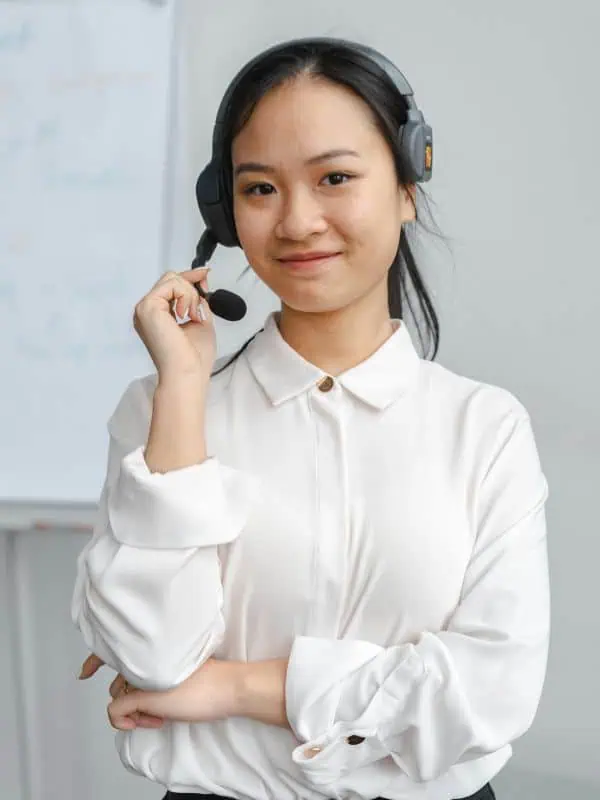 Woman with headset to illustrate VoIP services