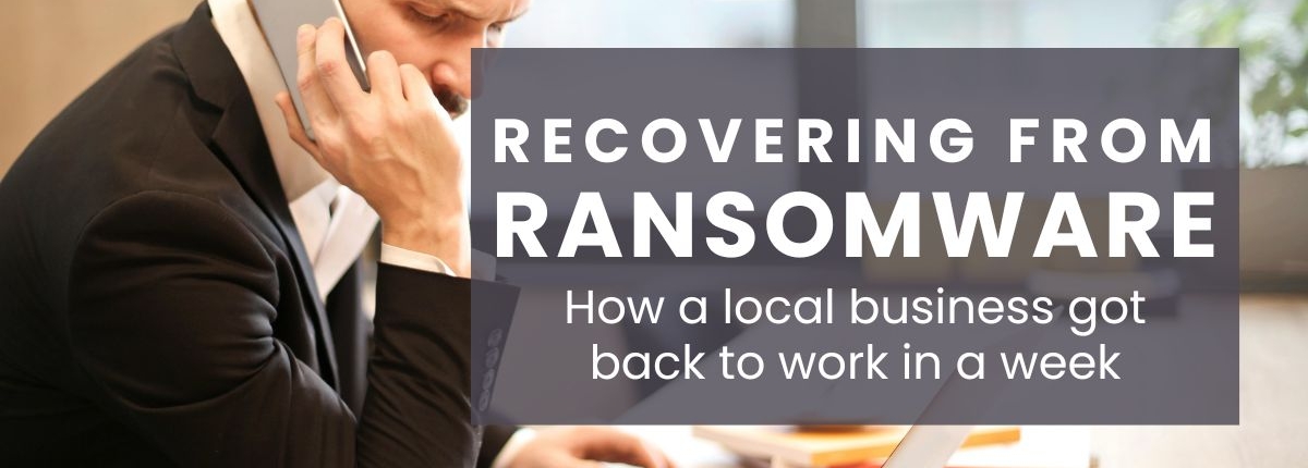 Cyberattack recovery service Recovering from Ransomare: How a local business got back to work in a week. Man at desk on phone with cconcerned look on his face