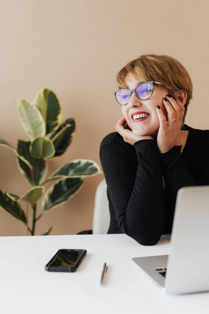 smiling female office worker at desk