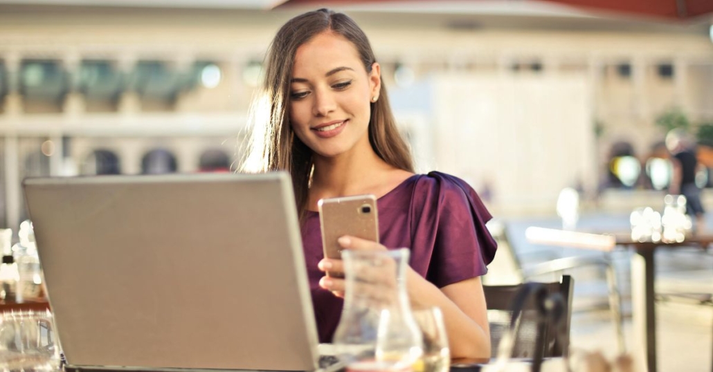sharepoint automation illustrated with woman working from laptop and phone