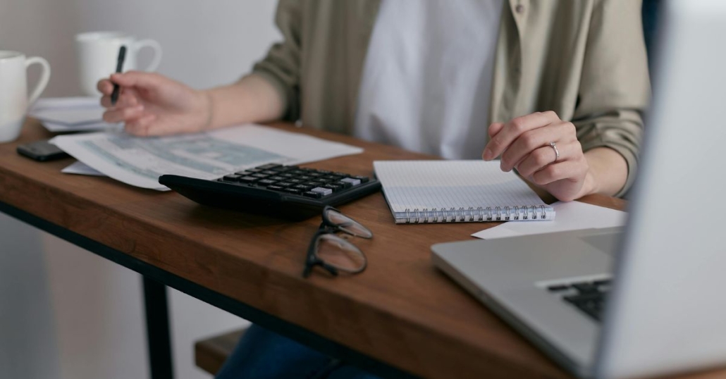 officer worker with calculator and bills